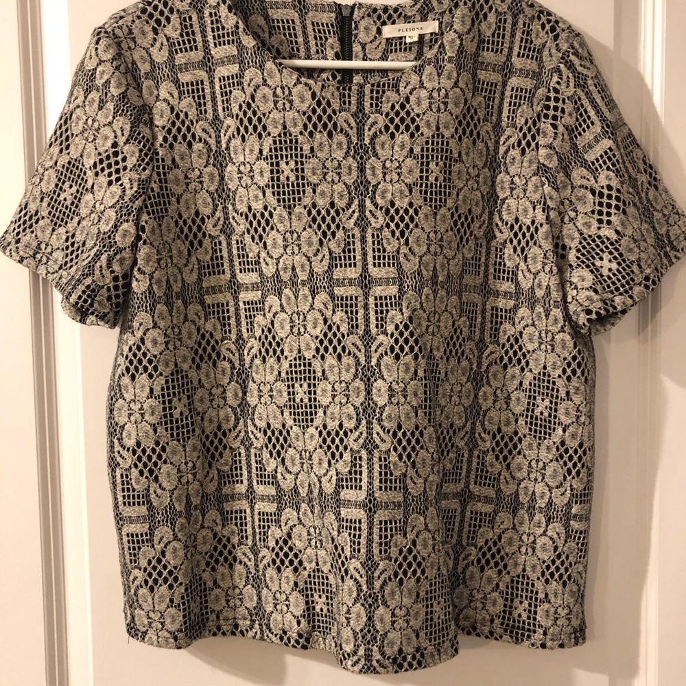 Pleione black top with lace overlay. Zippered back